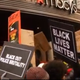 Protesters for justice in Ferguson, Mo., and worker rights demonstrate outside Macy’s in New York City Nov. 28, 2014.
Yahoo screenshot
